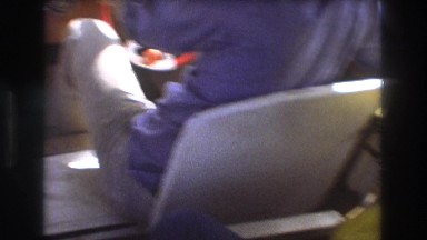 1975: cute family together on boat wearing safety equipments BOSTON