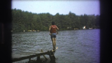 1975: man getting ready to jump in the lake. BOSTON
