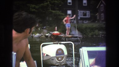 1975: motorboat being hauled to dock BOSTON