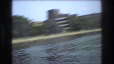 1975: large lake with lot of huge buildings on its shore BOSTON