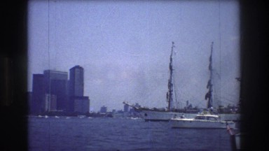 1976: various types of boats crossing the harbor in the port of a large city