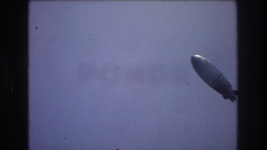 1976: old goodyear blimp flying across clear skies NEW YORK CITY