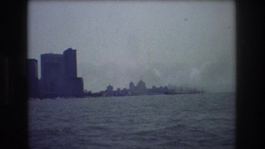 1976: coastal city waves boating viewing large vessel boats in dark blue sea