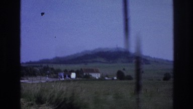 1967: rushing through green rural hill country in a motor car