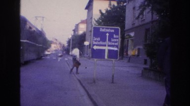 1967: some traffic on road with a tram moving on the opposite side. FRANCE