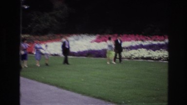 1967: family walking along, looking at the flowers. OTTAWA CANADA