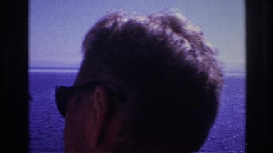 1967: a group of people are gathered on the deck of a ship on a breezy day