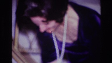 1967: woman in dress dancing with an orange cat OTTAWA CANADA
