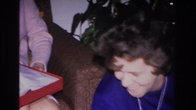 1966: Various People Inside Around a Christmas Tree Opening Gifts Hoboken