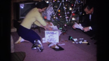 1966: a couple unwrapping the gift boxes to see the items HOBOKEN NEW JERSEY