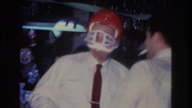 1966: a man in a bar wearing an orange football helmet HOBOKEN NEW JERSEY