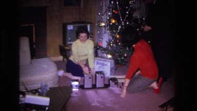 1966: two women on the floor opening christmas gifts HOBOKEN NEW JERSEY