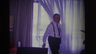 1966: a man coming moving curtains talking lady standing house beautiful HOBOKEN