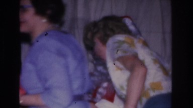1966: a long line of mature women take presents from santa claus