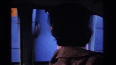 1966: lady driving car looking happy wearing gloves paying tax returning change