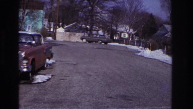1966: car makes u-turn on road. HOBOKEN NEW JERSEY