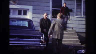 1966: men greeting in front of house HOBOKEN NEW JERSEY