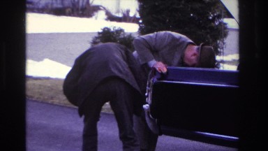 1966: two men are checking the problem of a car on the road HOBOKEN NEW JERSEY