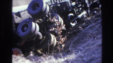 1966: various people outside examining an overturned semi trailer truck HOBOKEN
