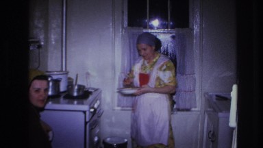1966: woman fixing dinner for her family. HOBOKEN NEW JERSEY