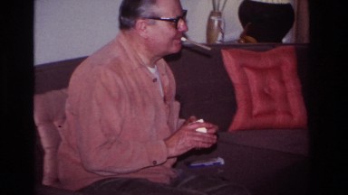 1966: a child sitting on a grandpas lap on top of a sofa HOBOKEN NEW JERSEY
