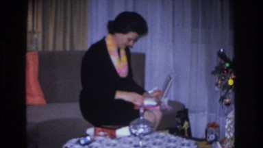 1966: woman open a jewelry gift HOBOKEN NEW JERSEY