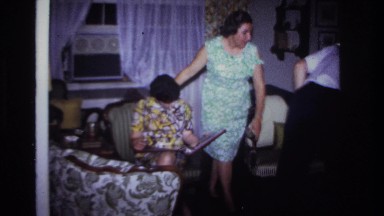 1967: indoor family scene mother seeing child ROCKAWAY BEACH NEW YORK