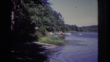 1968: people relaxing on a dock by a calm lake OCEAN CITY NEW JERSEY