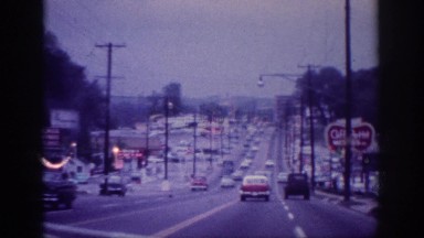 1963: a busy street in the city with many vehicles running to and fro MEMPHIS