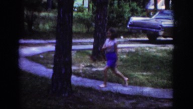 1962: girl hides during view of house and lawn RALEIGH NORTH CAROLINA
