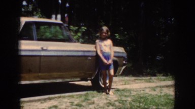 1962: young girl standing beside a car. RALEIGH NORTH CAROLINA
