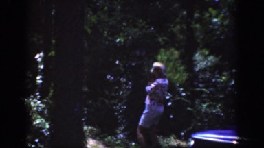1962: Several Elderly People Explore Blooming Flowers and Trees in the Front Yard
