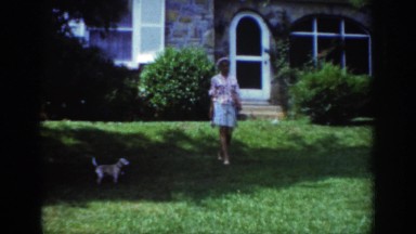 1962: a woman and her kid is playing with the dog RALEIGH NORTH CAROLINA