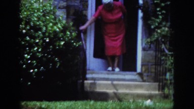 1962: old lady is coming out of the house RALEIGH NORTH CAROLINA