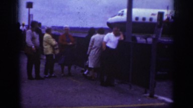 1962: people looking at plane being loaded RALEIGH NORTH CAROLINA