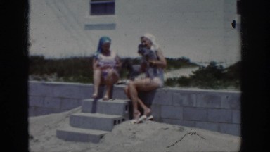 1962: two girls outside playing with their two puppies RALEIGH NORTH CAROLINA
