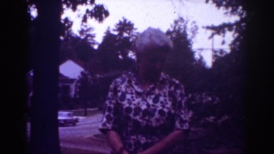 1962: beautiful lady with grey coiffure speaking and smiling