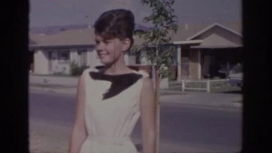 1966: happy couple waving and walking in suburbs SACRAMENTO CALIFORNIA