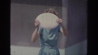 1967: woman smiles while holding frisbee OKLAHOMA