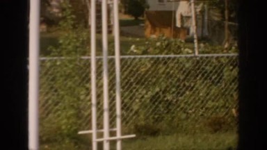 Swing-Set in Yard Surrounded by Chain-Link Fence Oklahoma