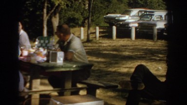 1967: a family gathered at a recreational area for a picnic