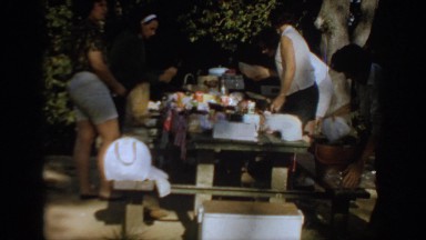 1967: a family outside preparing food on a table for a picnic OKLAHOMA
