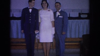 1967: bride, groom and father posing for wedding photos. OKLAHOMA