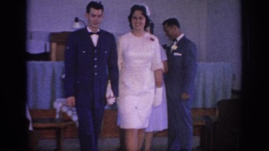 1967: couples in amazing dresses walking in the hall with many people OKLAHOMA