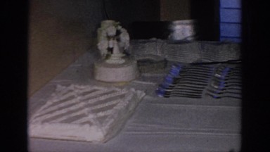 1967: the cake is sitting on the table waiting to get consumed by the wedding