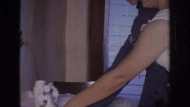 1967: a newly wed couple cutting a wedding cake in an informal setting OKLAHOMA
