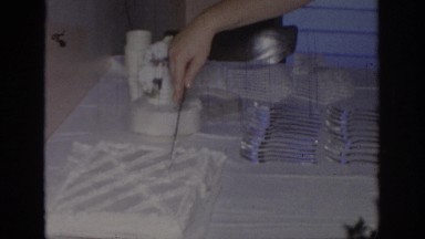 1967: mother cutting birthday cake for serving people OKLAHOMA
