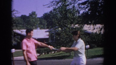 1967: a young couple playing a rough game on the front lawn OKLAHOMA