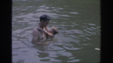 1967: father and son playing in the lake together. OKLAHOMA