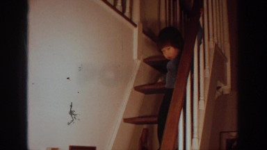1972: Asian Child Walking Down Stairs in Philadelphia, Pennsylvania